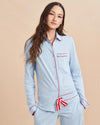 Pajama party ready. Our PJs are cut from our super soft t-shirt fabric for the ultimate in comfort and style when you need a little hygge. Pale blue cotton framed with contrasting red piping, our PJ set has a relaxed-fit top and elasticated drawstring wide-leg pants.