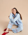 Pajama party ready. Our PJs are cut from our super soft t-shirt fabric for the ultimate in comfort and style when you need a little hygge. Pale blue cotton framed with contrasting red piping, our PJ set has a relaxed-fit top and elasticated drawstring wide-leg pants.