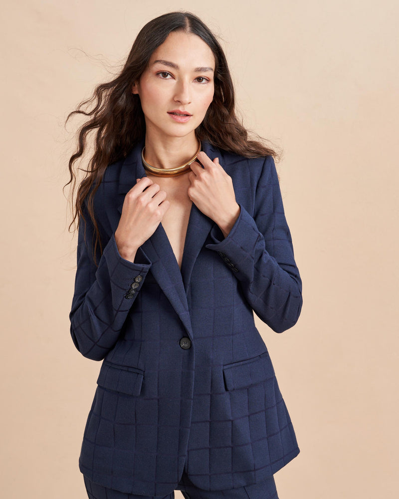 Don't take your suit to work, make it work for you. Our Frankie Blazer is made from a soft plaid, jacquard stretch fabric with a slim fit at the waist. For the full effect make sure you add the matching pant to your basket.