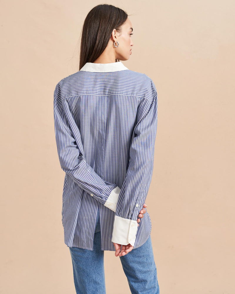 We all know about having at least one, crisp, white shirt-but the fluid, soft striped version could be your wardrobe's secret weapon. Equally luxe yet comfortable, this classic piece is at home with denim and adds some borrowed-from-the-boys femininity when paired with slacks. Layer it under sweaters or unbutton it down-to-there, this shirt a girl's best friend.