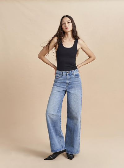 Relaxed and easy, this high rise, wide leg, in non-stretch denim is that favorite jean that you wear on repeat whether with a sneaker or leveling up with a heel. 