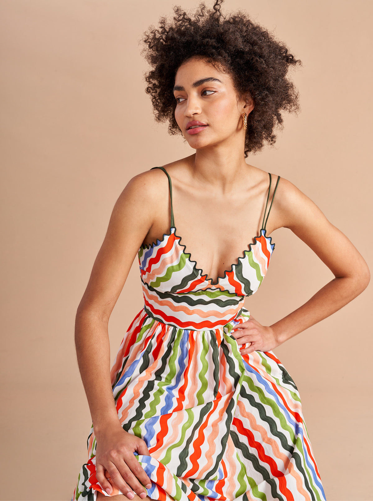 Named after La Bande muse and stylist, Jamie Mizrahi, this classic but modern silhouette in our favorite squiggle print, with a scallop, v-neckline is sweet with the right about of sass. Layer a bodysuit (or a swimsuit) under it or layer over with one of our stripey Marins for extra style punch, but you won't lose points for keeping it simple as in, simply perfect.
