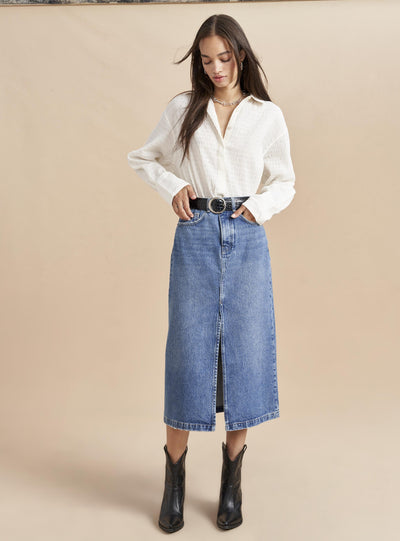 No denim collection is complete without this high rise, slightly A-line, medium wash, jean skirt. Pair it back to our Dean Jacket or simply top it off with one of our cozy, cashmere sweaters. Destined to get better with age since this classic, feminine skirt will never go out of style.