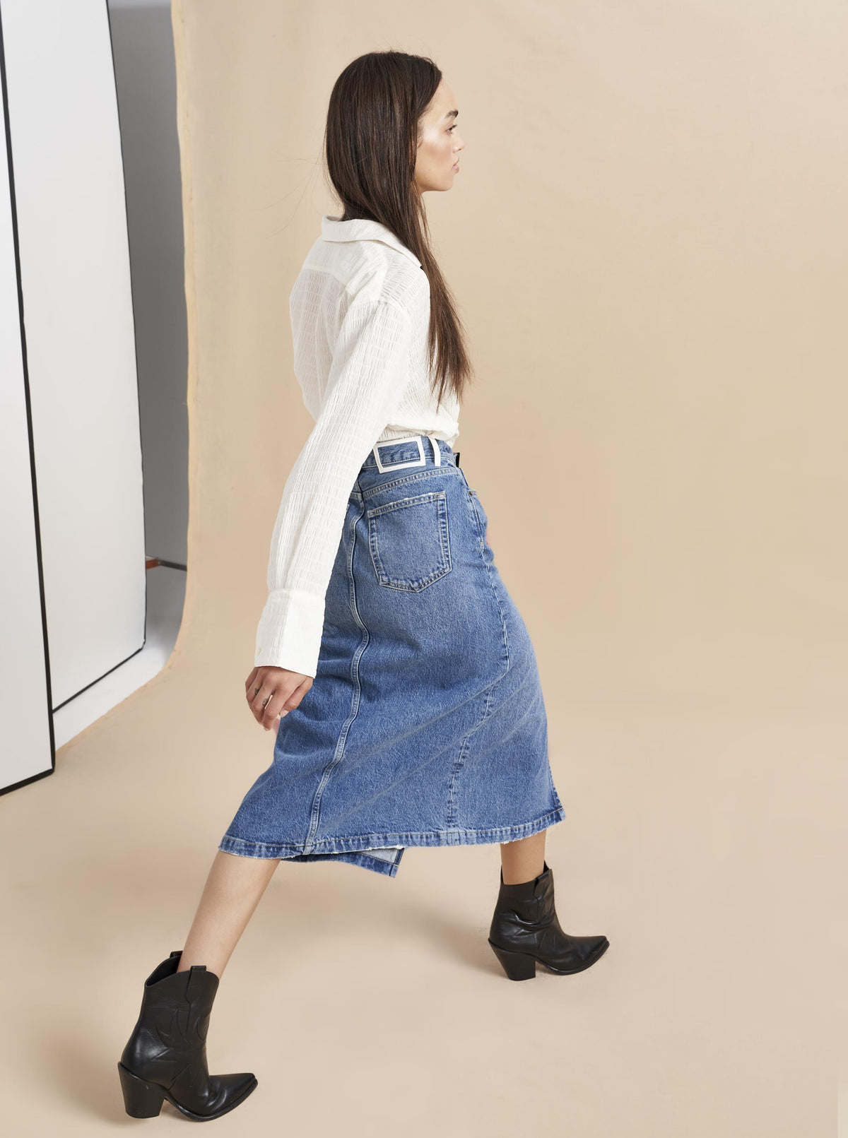 No denim collection is complete without this high rise, slightly A-line, medium wash, jean skirt. Pair it back to our Dean Jacket or simply top it off with one of our cozy, cashmere sweaters. Destined to get better with age since this classic, feminine skirt will never go out of style.