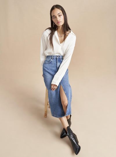 No denim collection is complete without this high rise, slightly A-line, medium wash, jean skirt. Pair it back to our Dean Jacket or simply top it off with one of our cozy, cashmere sweaters. Destined to get better with age since this classic, feminine skirt will never go out of style.