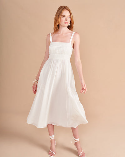 Easy doesn't always have to mean simple and this dress gives you a ton of punch with thoughtful design details in a flattering fit and flare silhouette, like a ruched bodice with multi needle topstitching, shirring at the  waist, smocking at the back and those essential pockets for easy-does-it, slow strolls along (enter fantasy backdrop here).