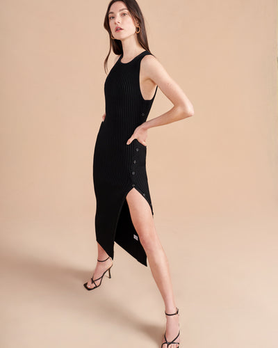 A sure to be staple in your wardrobe come summer or fall, this perfect knit rib dress has a functional button placket down the leg so you can decide whether you want the slit or not. Perfect over boots or sandals, you'll wonder how you lived out without this dress-it-up or dress-it-down dress.