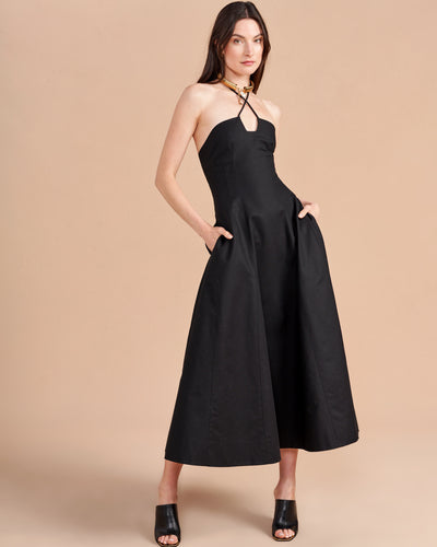 Some dresses are not meant to sit in your closet. This one will call your name so give in to the impulse, zip her up, and paint the town with this cotton stretch, halter neck, fit and flare frock. Dress up to get down. 