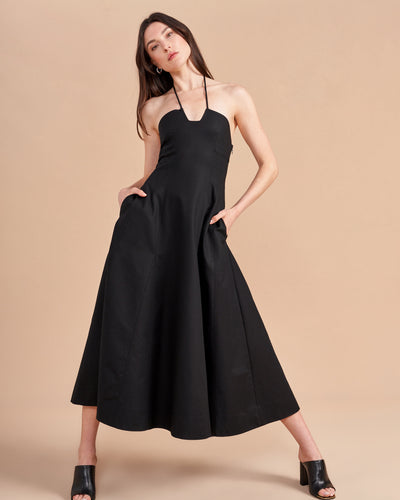 Some dresses are not meant to sit in your closet. This one will call your name so give in to the impulse, zip her up, and paint the town with this cotton stretch, halter neck, fit and flare frock. Dress up to get down. 