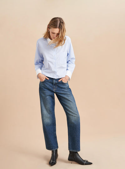 She's a little bit retro, a little bit nostalgic but totally modern. Our newest jean in non-stretch cotton with a slightly curved, barreled leg is a styling dream-it accentuates the waist and exaggerates the leg. Tuck in a tee or pair back to a cropped shirt or sweater but the fun is deciding which shoe to show off.