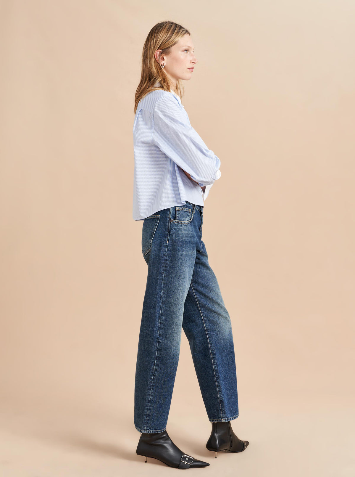 She's a little bit retro, a little bit nostalgic but totally modern. Our newest jean in non-stretch cotton with a slightly curved, barreled leg is a styling dream-it accentuates the waist and exaggerates the leg. Tuck in a tee or pair back to a cropped shirt or sweater but the fun is deciding which shoe to show off.