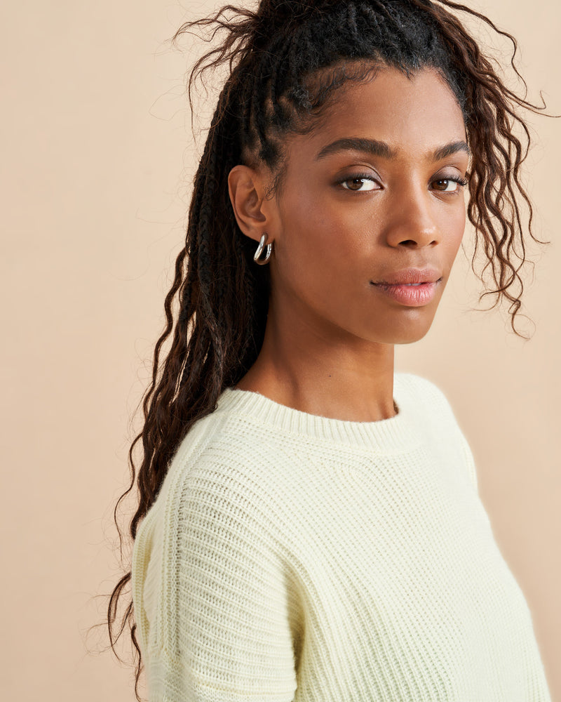 This is it. This is your everyday, never-without, take-with-you-everywhere sweater that will always have your back. Deliciously ribbed cashmere in a loose crewneck and slightly cropped silhouette means you need one in every color for tous les jours. 