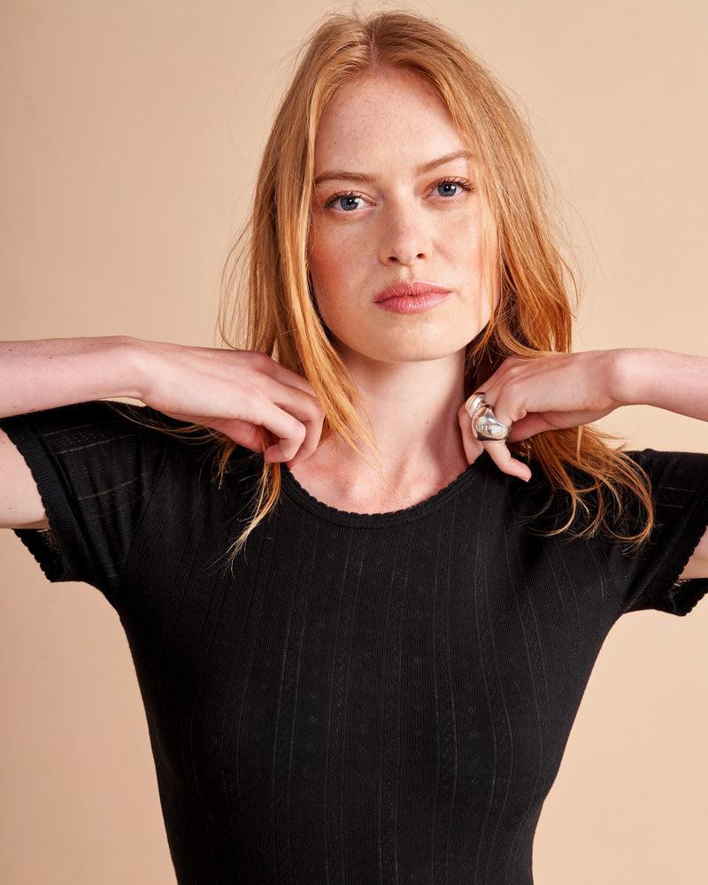 Our tee collection would not be complete without this tried and true French pointelle classic. Made from the softest viscose blend, this tee features scallop details at the neck and hem with pointelle lines throughout. C'est magnifique!