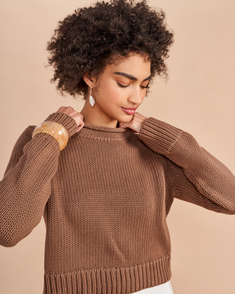 Our infamous Mini Marina Sweater, now in solid colors so get on board whether you are in the mood for all over stripes or not in our best-selling, chunky, 100% cotton sweater with our signature Marina rollneck that you know and love us for.