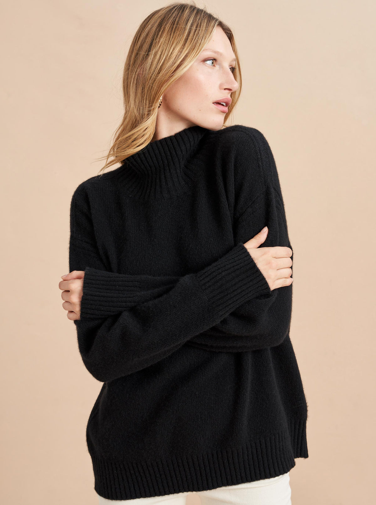 Our co-founder Valerie Macaulay's favorite turtleneck, this oversized sweater in buttery soft recycled cashmere, is chic with winter white, excellent over your favorite denim and a no brainer with a classic wide leg trouser. This knit was made to be your go-to season after season.