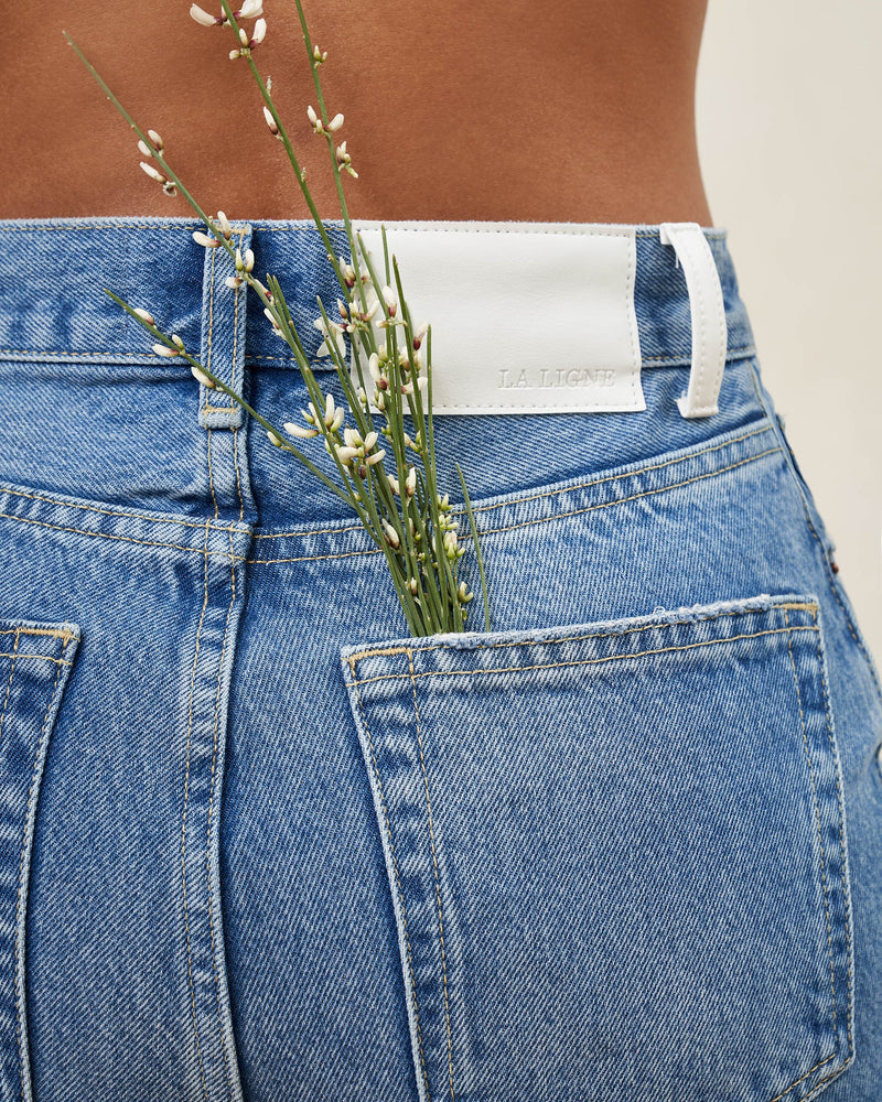 The classic, high-rise, non-stretch, straight-leg jean that gets better after each wear, never goes out of style, never disappoints and you can never get enough of, AKA The Molly jean or The Mom Jean, aptly named after our co-founder that will take you from 9 to 5, after hours and beyond. 