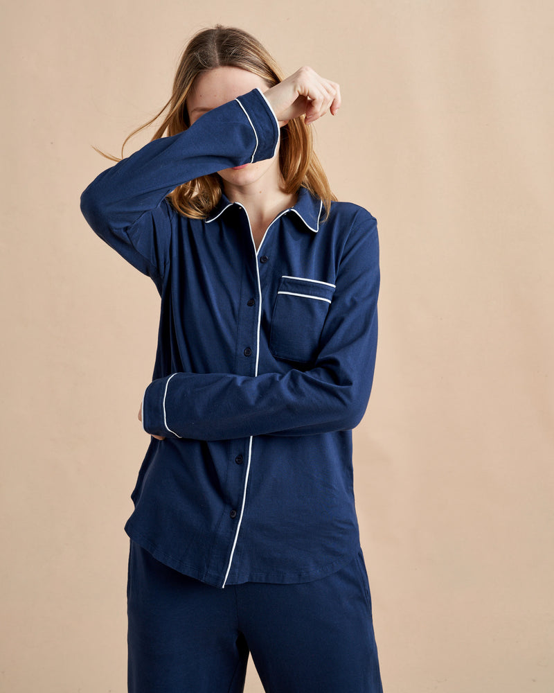 Pajama party ready. Our PJs are cut from our super soft t-shirt fabric for the ultimate in comfort and style when you need a little hygge. Navy cotton framed with contrasting white piping, our PJ set has a relaxed-fit top and elasticated drawstring wide-leg pants.