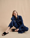 Pajama party ready. Our PJs are cut from our super soft t-shirt fabric for the ultimate in comfort and style when you need a little hygge. Navy cotton framed with contrasting white piping, our PJ set has a relaxed-fit top and elasticated drawstring wide-leg pants.