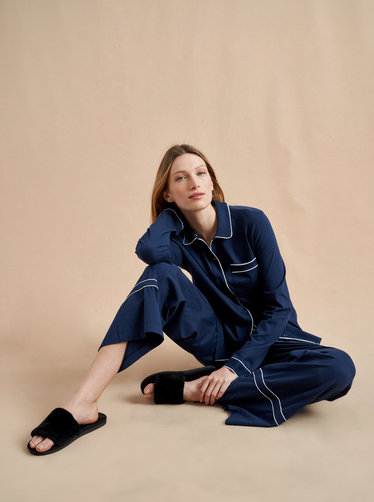 Pajama party ready. Our PJs are cut from our super soft t-shirt fabric for the ultimate in comfort and style when you need a little hygge. Navy cotton framed with contrasting white piping, our PJ set has a relaxed-fit top and elasticated drawstring wide-leg pants.