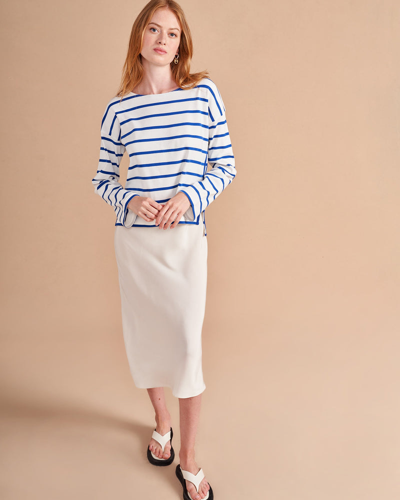 The epitome of quintessential Breton style, this long sleeve tee does it all in 100% super soft ivory cotton with cobalt stripes.