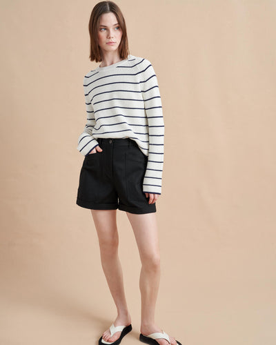 An allover stripe classic in a supremely-soft, easy cotton blend. This cropped yet boxy sweater is perfect for layering, holds its own under a suit and right at home with our newest denim. 