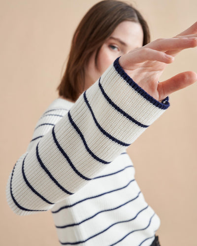 An allover stripe classic in a supremely-soft, easy cotton blend. This cropped yet boxy sweater is perfect for layering, holds its own under a suit and right at home with our newest denim. 