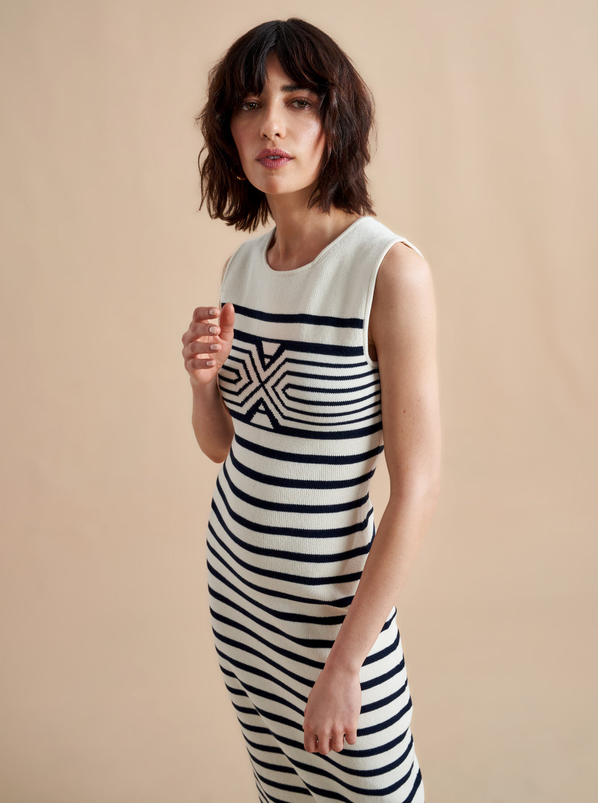 Is there anything better than a dress that does it all, from comfort, to style, to care? Meet Emmanuelle, our sleek, cotton stretch dress that slips over the head but still packs a punch on details. Made up of delicate ribbed stripes and an engineered striped design on the chest, this fitted dress with a touch of Lycra will hug you in all the right ways. Hand wash it at home and wear it again tomorrow.