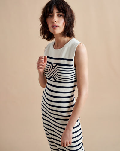 Is there anything better than a dress that does it all, from comfort, to style, to care? Meet Emmanuelle, our sleek, cotton stretch dress that slips over the head but still packs a punch on details. Made up of delicate ribbed stripes and an engineered striped design on the chest, this fitted dress with a touch of Lycra will hug you in all the right ways. Hand wash it at home and wear it again tomorrow.