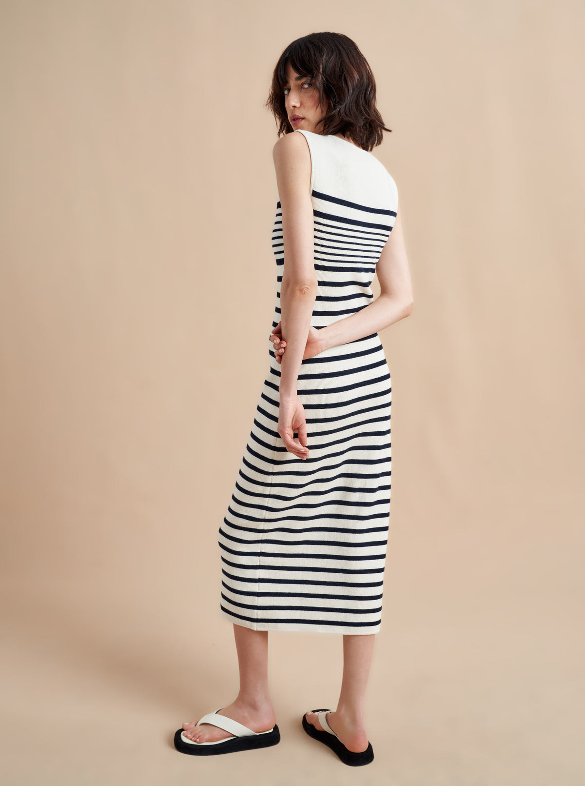Is there anything better than a dress that does it all, from comfort, to style, to care? Meet Emmanuelle, our sleek, cotton stretch dress that slips over the head but still packs a punch on details. Made up of delicate ribbed stripes and an engineered striped design on the chest, this fitted dress with a touch of Lycra will hug you in all the right ways. Hand wash it at home and wear it again tomorrow.