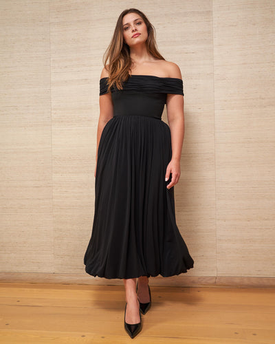 Channel your inner Grace Kelly and slip into this sleek, off-the-shoulder black dress with stretch bodice for the ultimate perfect fit.