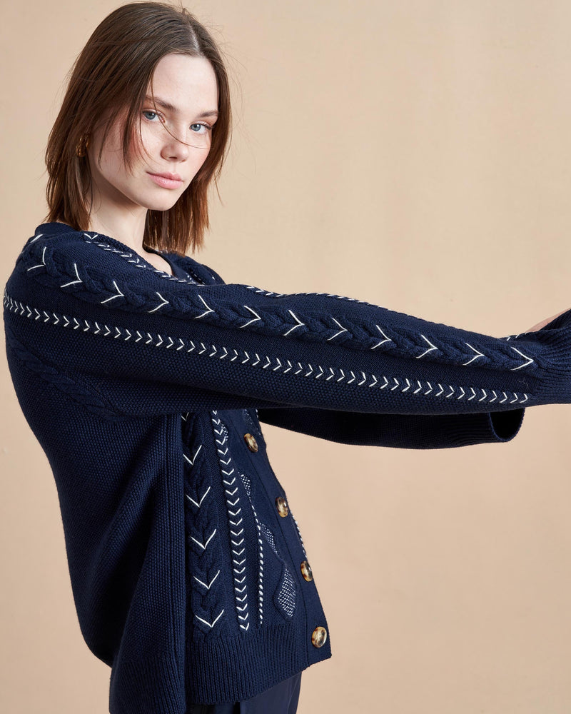 A heritage fisherman knit style cardigan with avant garde cable stitches in an oversized, lived-in, cozy fit that will make you wonder how you've lived without out it this whole time.