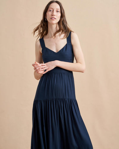 Inspired by musician and La Ligne muse, Laura Lee, this sexy stunner made from 100% sustainable viscose in classic navy is made for getting down and rocking out featuring a wide v-neck and smocked back and waist panels so nothing gets in the way of having a good time.