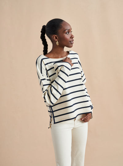 The epitome of quintessential Breton style, this long sleeve tee does it all in 100% super soft cream cotton with navy stripes.