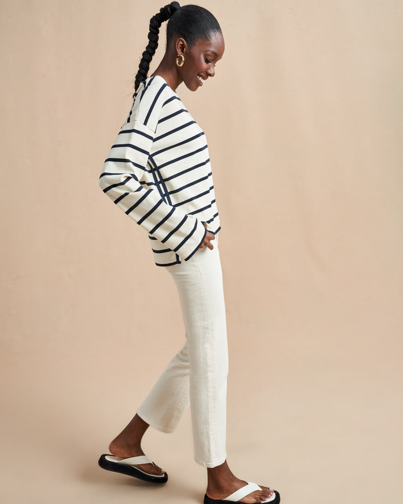 The epitome of quintessential Breton style, this long sleeve tee does it all in 100% super soft cream cotton with navy stripes.