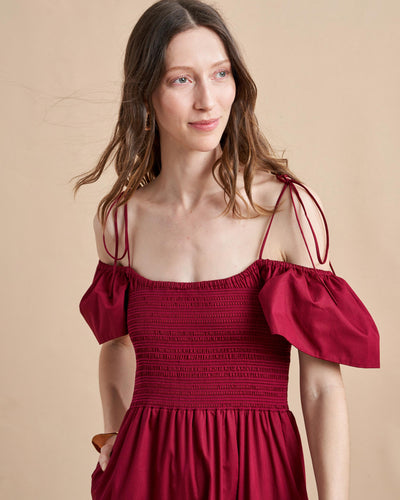 The ideal transitional dress in light cotton, to be worn on or off-the-shoulder with spaghetti straps and smocked bodice. The epitome of day-to-night, wear it with flats for day or pair with heels for an easy, breezy evening look. 