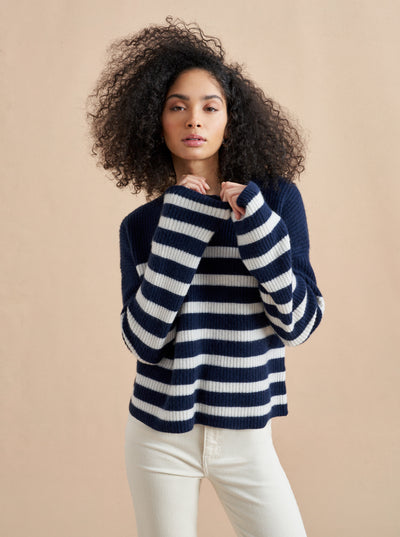 This is it. This is your everyday, never-without, take-with-you-everywhere sweater that will always have your back. Deliciously ribbed cashmere in a loose crewneck and slightly cropped silhouette means you need one in every color for tous les jours. 