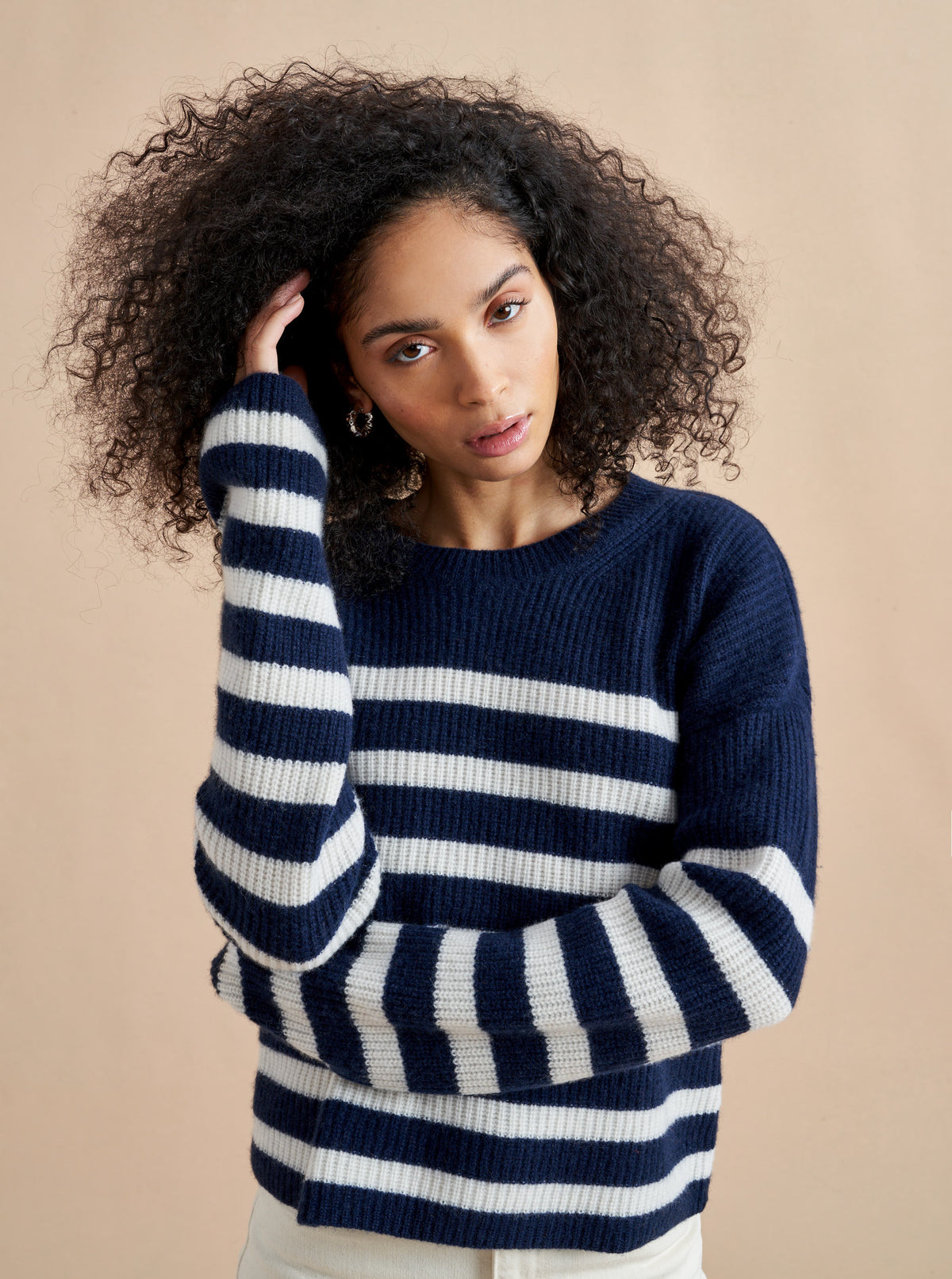 This is it. This is your everyday, never-without, take-with-you-everywhere sweater that will always have your back. Deliciously ribbed cashmere in a loose crewneck and slightly cropped silhouette means you need one in every color for tous les jours. 