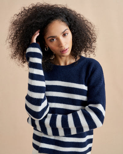 This is it. This is your everyday, never-without, take-with-you-everywhere sweater that will always have your back. Deliciously ribbed cashmere in a loose crewneck and slightly cropped silhouette means you need one in every color for tous les jours. 