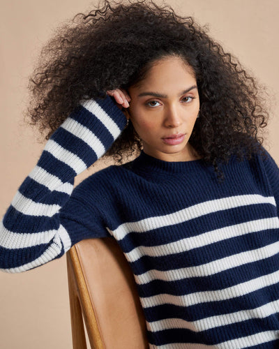 This is it. This is your everyday, never-without, take-with-you-everywhere sweater that will always have your back. Deliciously ribbed cashmere in a loose crewneck and slightly cropped silhouette means you need one in every color for tous les jours. 