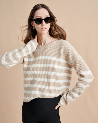 This is it. This is your everyday, never-without, take-with-you-everywhere sweater that will always have your back. Deliciously ribbed cashmere in a loose crewneck and slightly cropped silhouette means you need one in every color for tous les jours. 