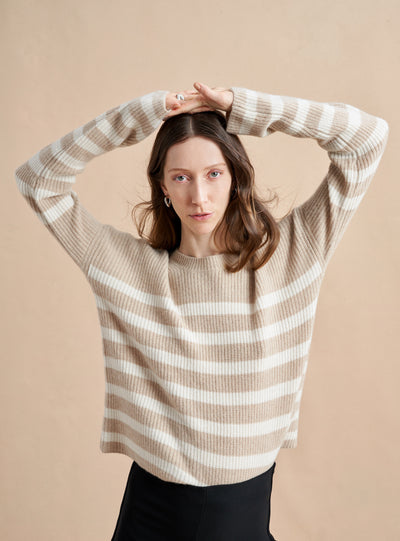 This is it. This is your everyday, never-without, take-with-you-everywhere sweater that will always have your back. Deliciously ribbed cashmere in a loose crewneck and slightly cropped silhouette means you need one in every color for tous les jours. 