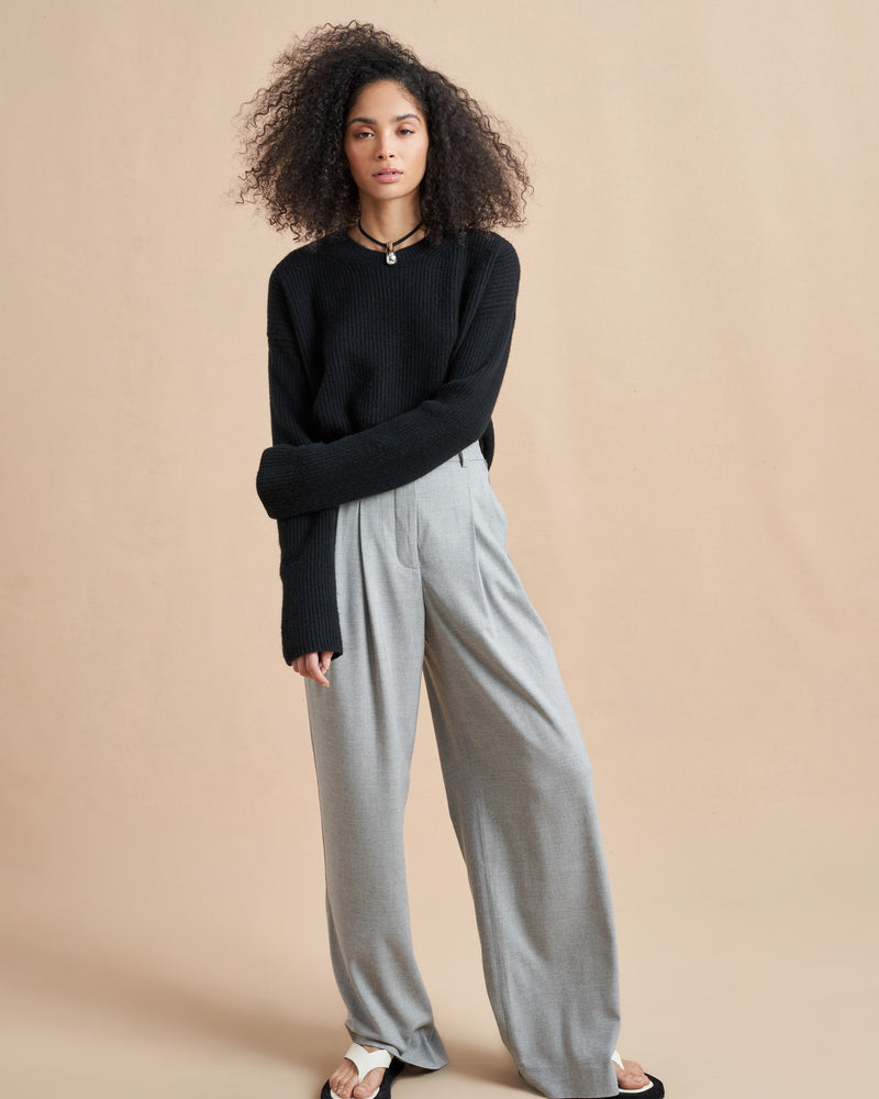 This is it. This is your everyday, never-without, take-with-you-everywhere sweater that will always have your back. Deliciously ribbed cashmere in a loose crewneck and slightly cropped silhouette means you need one in every color for tous les jours. 