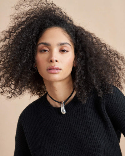 This is it. This is your everyday, never-without, take-with-you-everywhere sweater that will always have your back. Deliciously ribbed cashmere in a loose crewneck and slightly cropped silhouette means you need one in every color for tous les jours. 