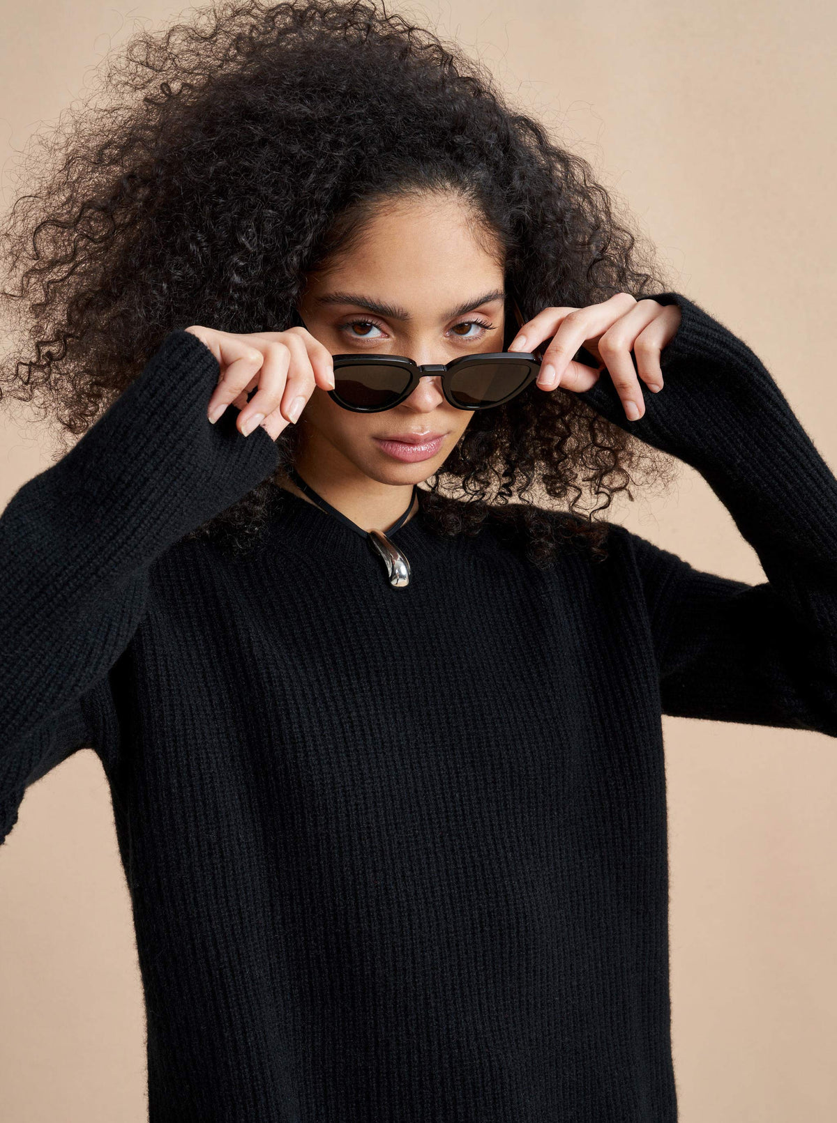 This is it. This is your everyday, never-without, take-with-you-everywhere sweater that will always have your back. Deliciously ribbed cashmere in a loose crewneck and slightly cropped silhouette means you need one in every color for tous les jours. 