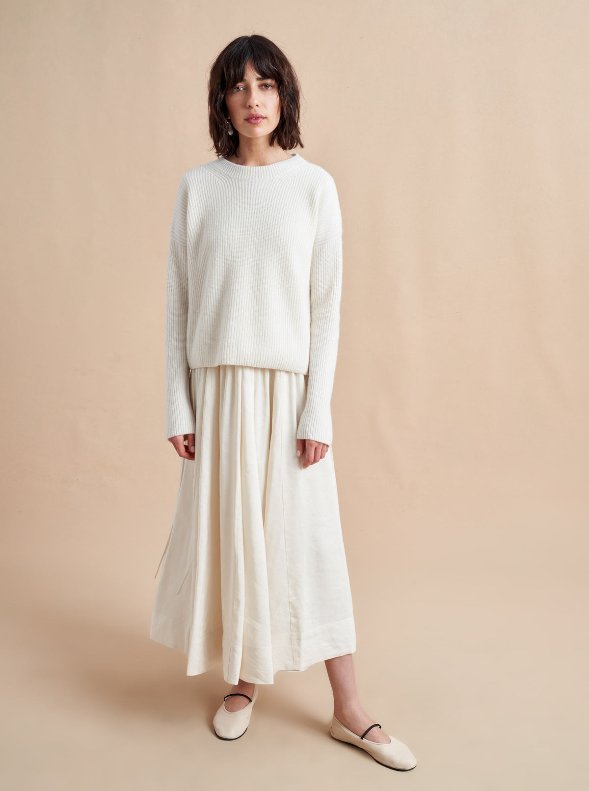 This is it. This is your everyday, never-without, take-with-you-everywhere sweater that will always have your back. Deliciously ribbed cashmere in a loose crewneck and slightly cropped silhouette means you need one in every color for tous les jours. 