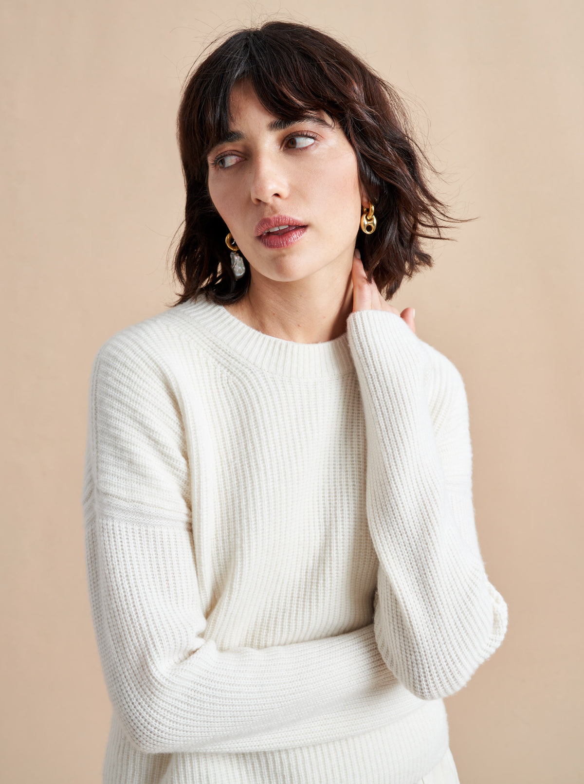 This is it. This is your everyday, never-without, take-with-you-everywhere sweater that will always have your back. Deliciously ribbed cashmere in a loose crewneck and slightly cropped silhouette means you need one in every color for tous les jours. 