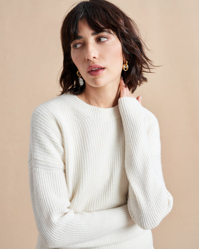 This is it. This is your everyday, never-without, take-with-you-everywhere sweater that will always have your back. Deliciously ribbed cashmere in a loose crewneck and slightly cropped silhouette means you need one in every color for tous les jours. 