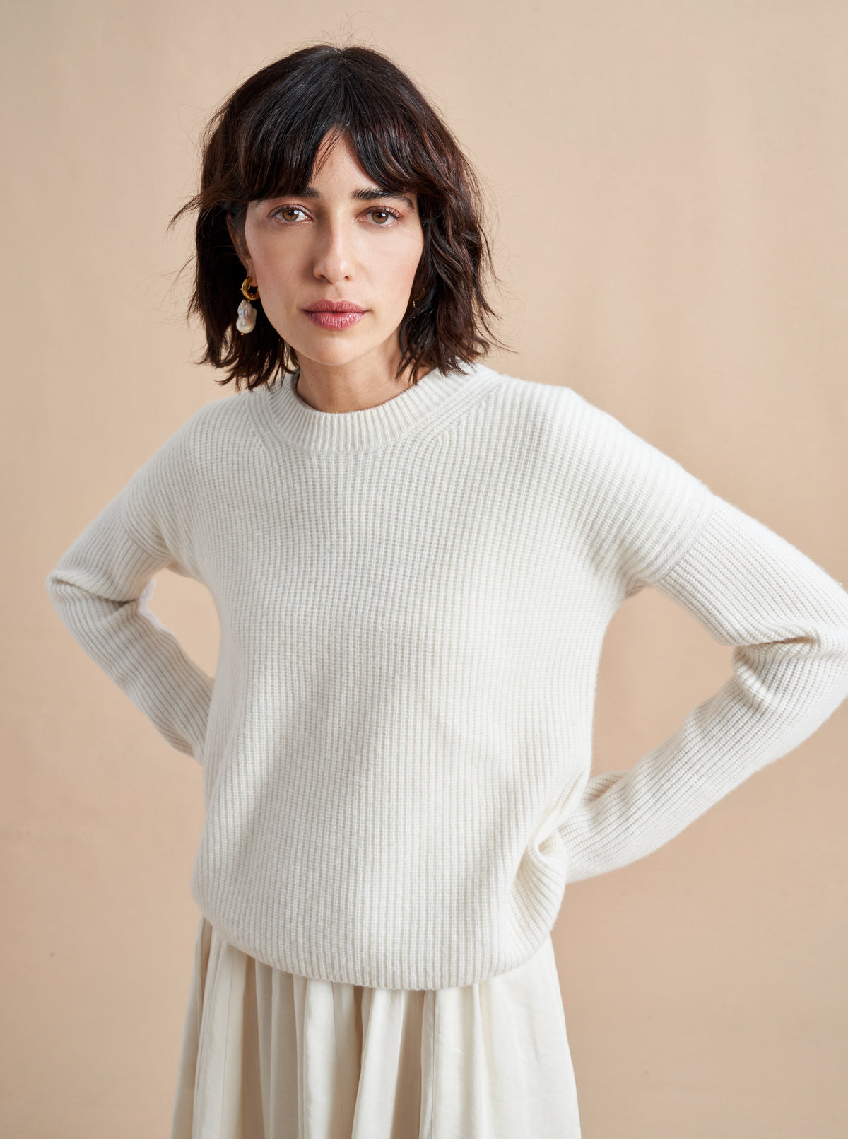 This is it. This is your everyday, never-without, take-with-you-everywhere sweater that will always have your back. Deliciously ribbed cashmere in a loose crewneck and slightly cropped silhouette means you need one in every color for tous les jours. 