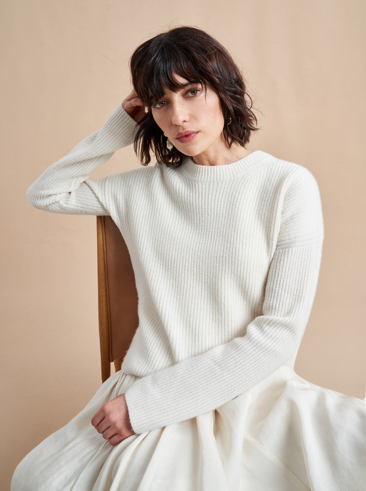 This is it. This is your everyday, never-without, take-with-you-everywhere sweater that will always have your back. Deliciously ribbed cashmere in a loose crewneck and slightly cropped silhouette means you need one in every color for tous les jours. 