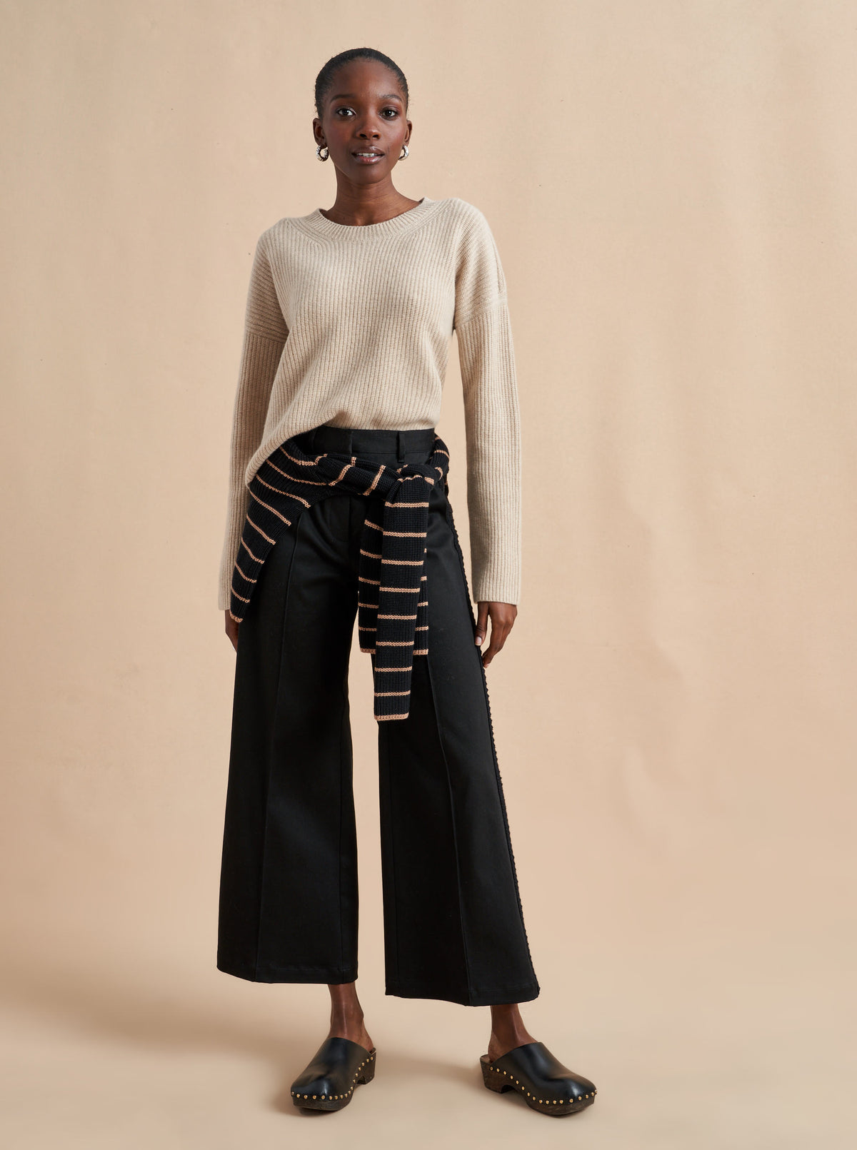 This is it. This is your everyday, never-without, take-with-you-everywhere sweater that will always have your back. Deliciously ribbed cashmere in a loose crewneck and slightly cropped silhouette means you need one in every color for tous les jours. 